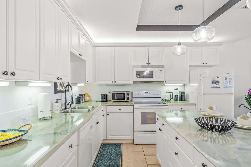 The kitchen offers ample storage space & all the comforts of home
