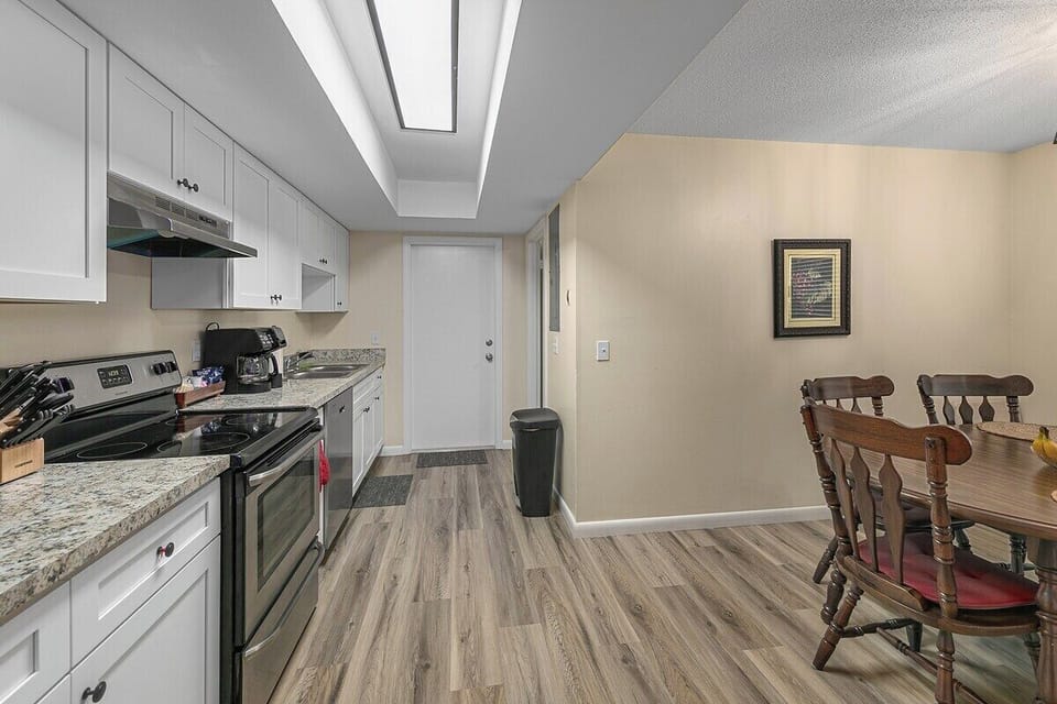 Full kitchen. Dishes, pans, flatware, knives, microwave, drip coffe maker, Keurig , dishwasher and full-sized fridge w freezer.
