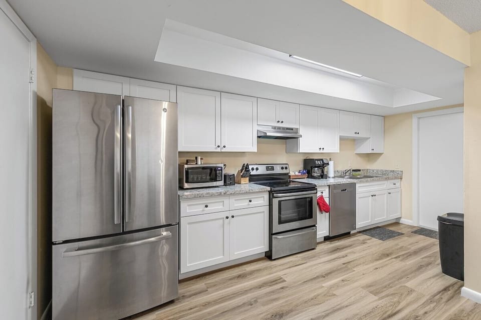 Full kitchen. Dishes, pans, flatware, knives, microwave, drip coffe maker, Keurig , dishwasher and full-sized fridge w freezer.