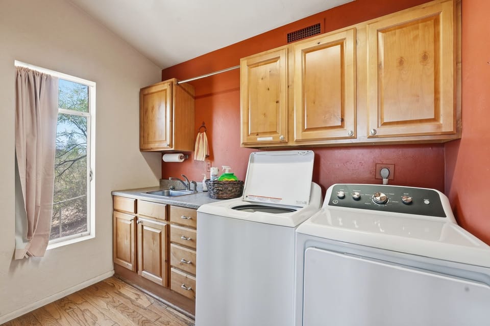 The laundry room is stocked with laundry detergent and dryer sheets