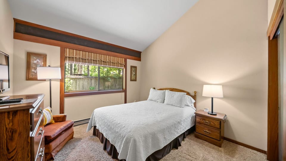 Second bedroom has a queen size bed and great views of the private backyard