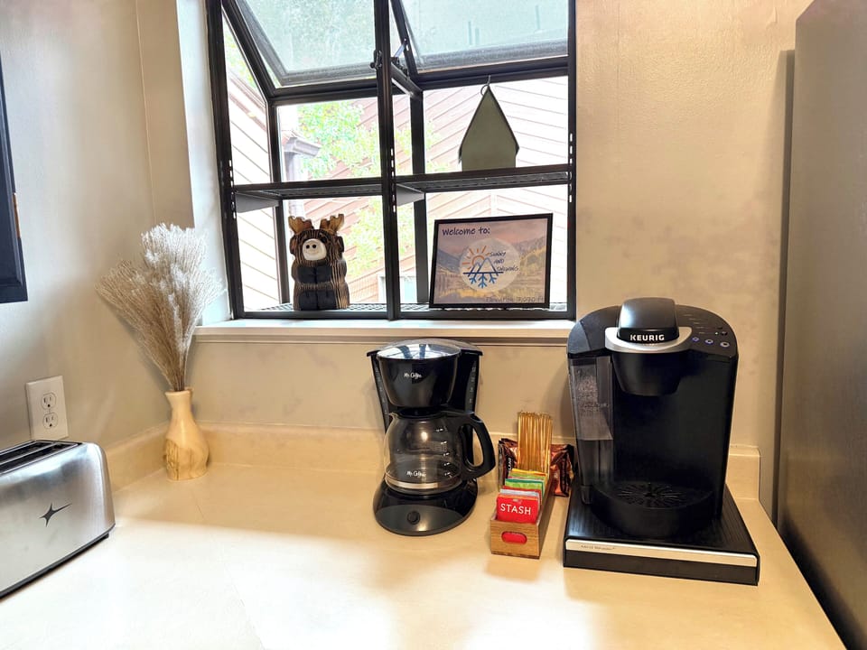 Caffeine station with drip coffee Kurig, and a variety of teas