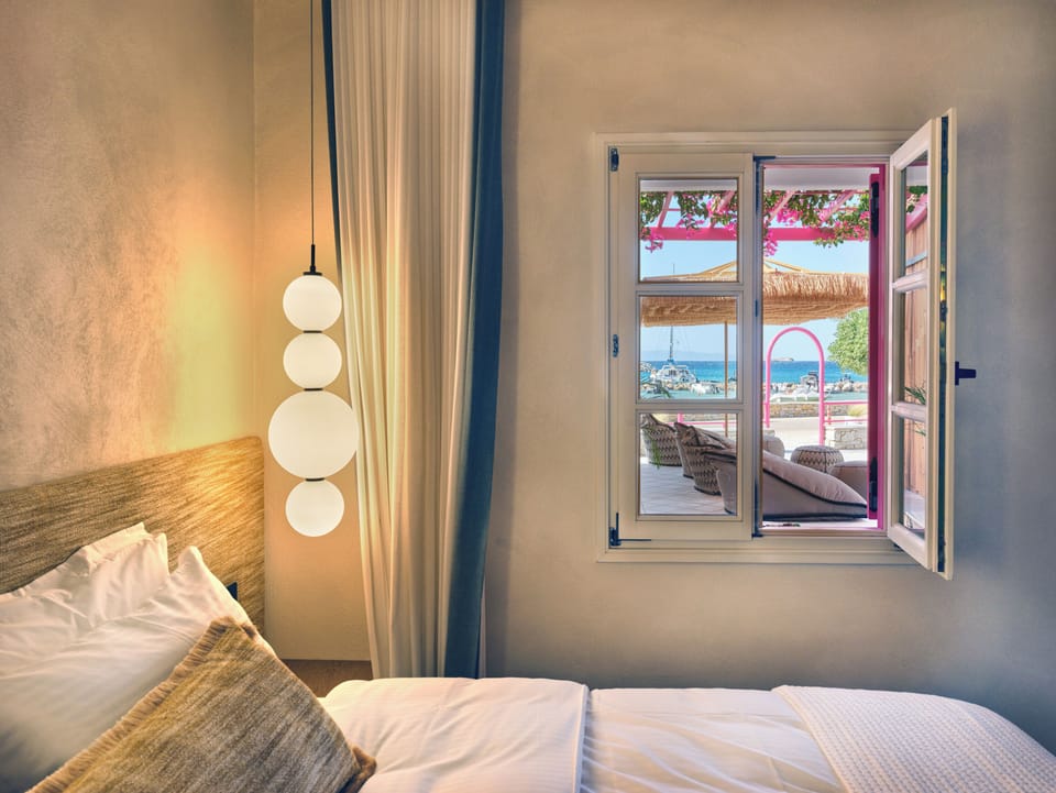 Deluxe Triple Room, Sea View | In-room safe, desk, laptop workspace, iron/ironing board