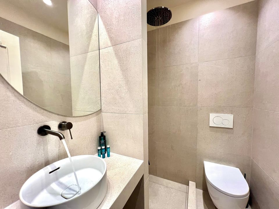 Luxury Triple Room, Patio, Mountain View | Bathroom | Shower, hair dryer, slippers, bidet