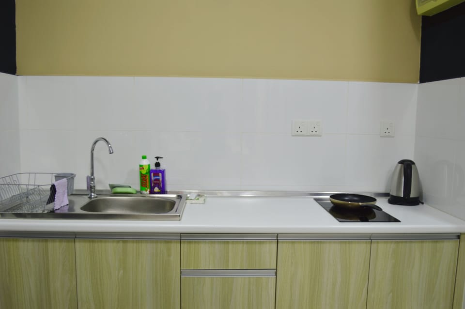 Family Studio, City View | Private kitchen | Fridge, electric kettle, cookware/dishes/utensils, dining tables