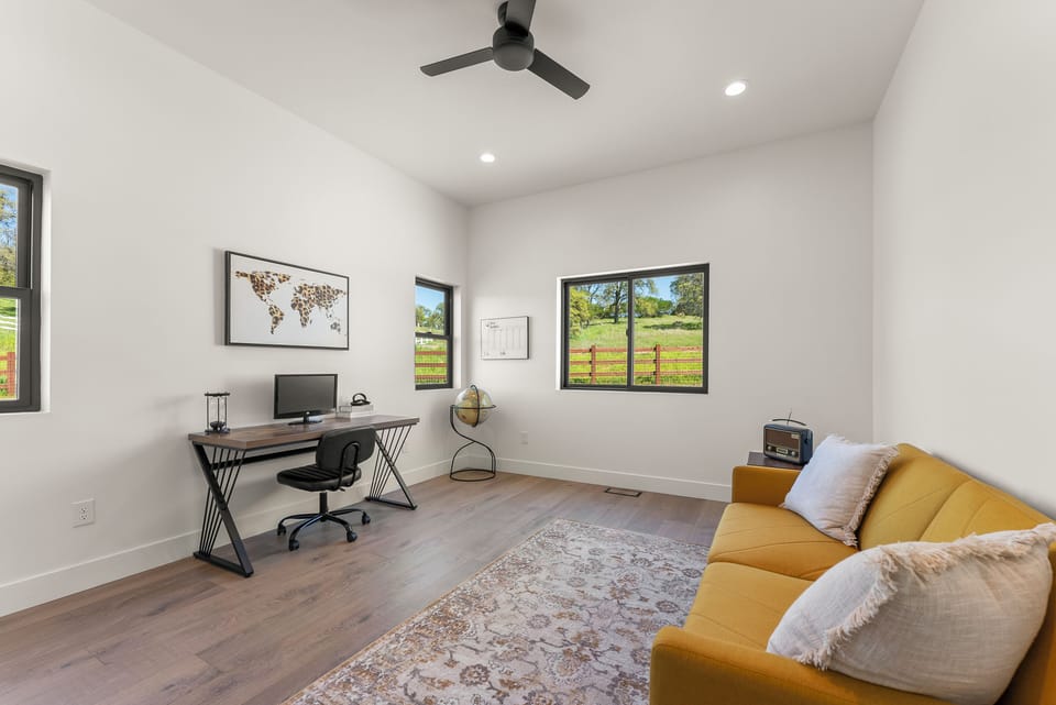 Fourth bedroom/office with pull-out sofa bed and work space.