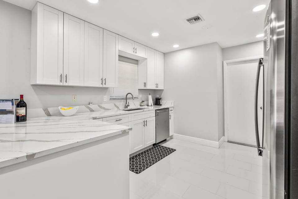 Newly remodeled kitchen with stainless steel appliances/ granite countertop.