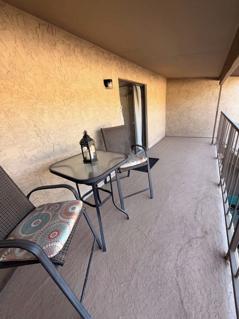 Private balcony off of the loft on the second floor with a staircase that connects to the lower outdoor patio.