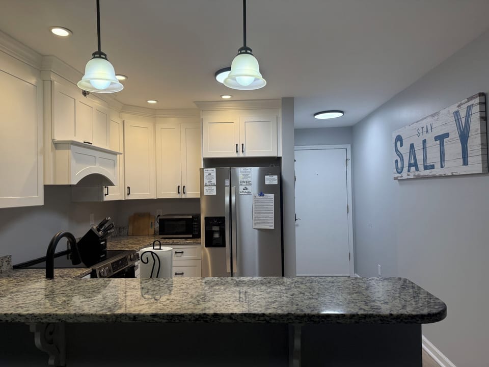 Kitchen photo from Living room area and entrance way