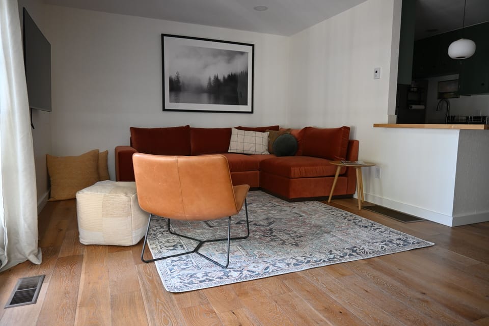 Comfortable living room sectional with 55" smart TV and high speed WiFi.