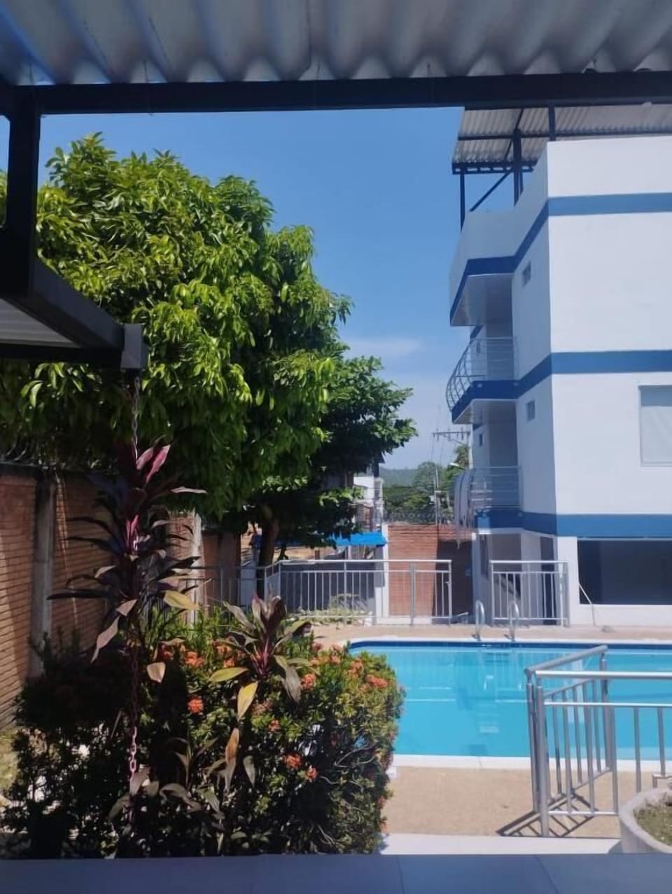 Outdoor pool, open 8:00 AM to midnight, pool umbrellas