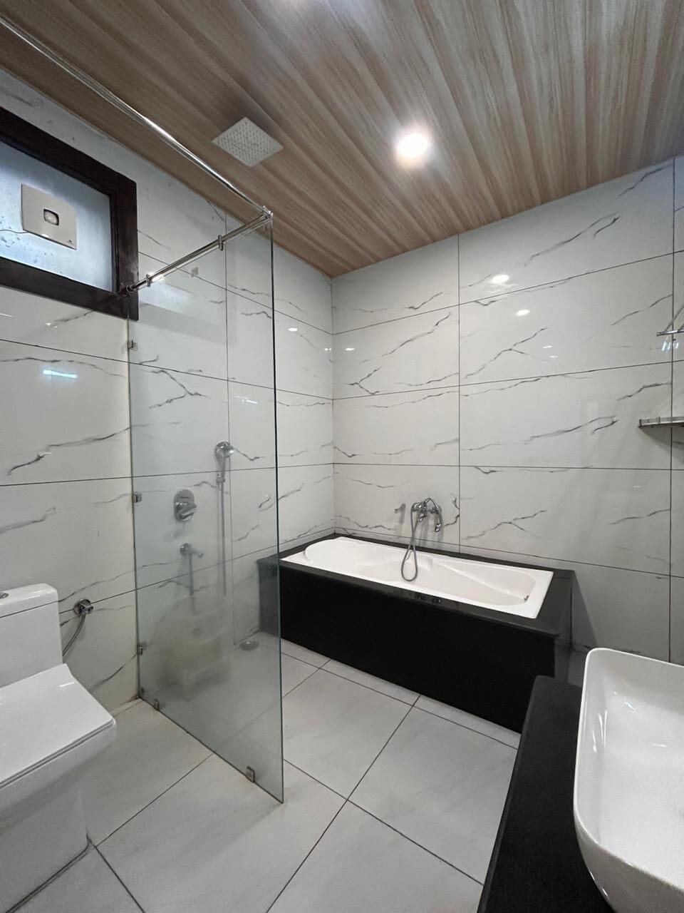 Superior Room | Bathroom | Shower, rainfall showerhead, designer toiletries, bathrobes