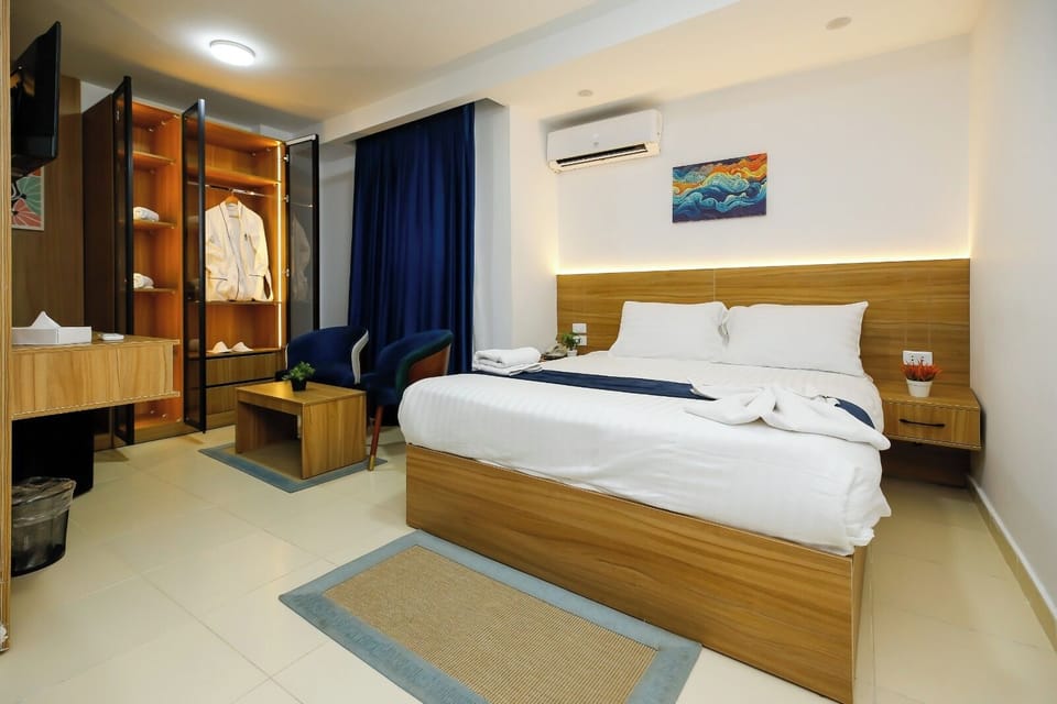 Deluxe Double or Twin Room | Desk, laptop workspace, blackout drapes, iron/ironing board
