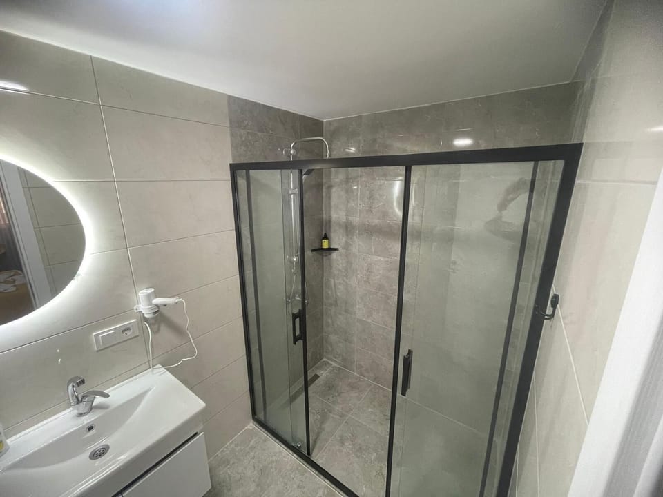 Family Room | Bathroom | Shower, hair dryer, slippers, towels