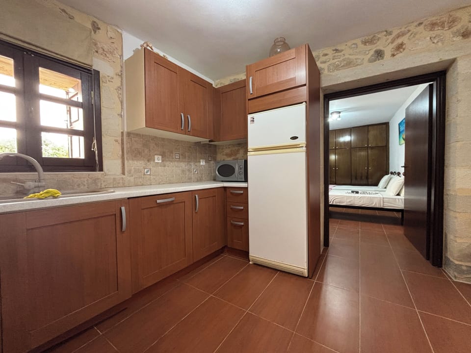Suite, Pool View | Private kitchen | Full-size fridge, microwave, oven, stovetop