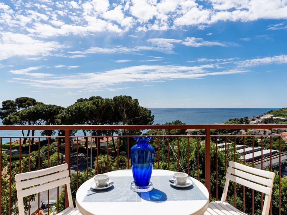 Furniture, Chair, Table, Outdoor Furniture, Outdoor Table, Porch, Kitchen & Dining Room Table, Balcony, Deck, Shade