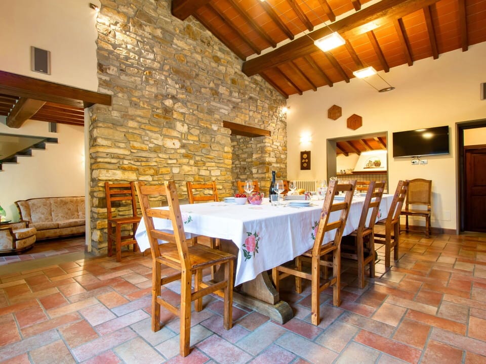 Wood, Furniture, Ceiling, Kitchen & Dining Room Table, Door, Stone Wall, Chair, Cottage, Beam, Dining Room
