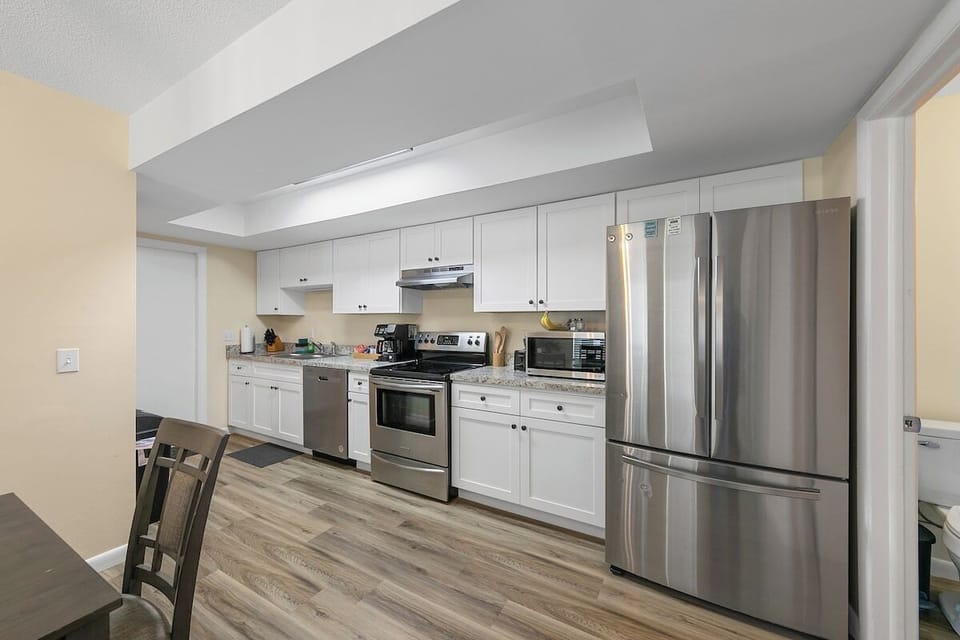 Full kitchen; dishes, pots and pans, flatware and knives, drip coffee maker, Keurig, microwave, dishwasher and full sized fridge and freezer. Coffee, sugar and creamer to get you started, and 4 or 5 various K-cups.