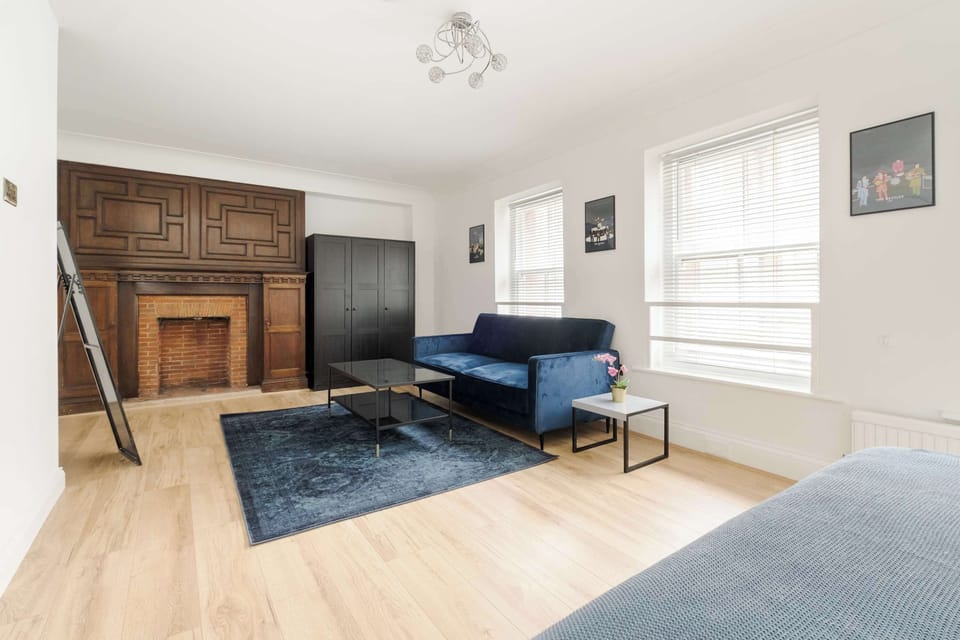 Bedroom | The bedroom features a comfortable king-size bed, complemented by an additional sofa bed and a smart LED TV, offering a relaxing and versatile space for your stay.