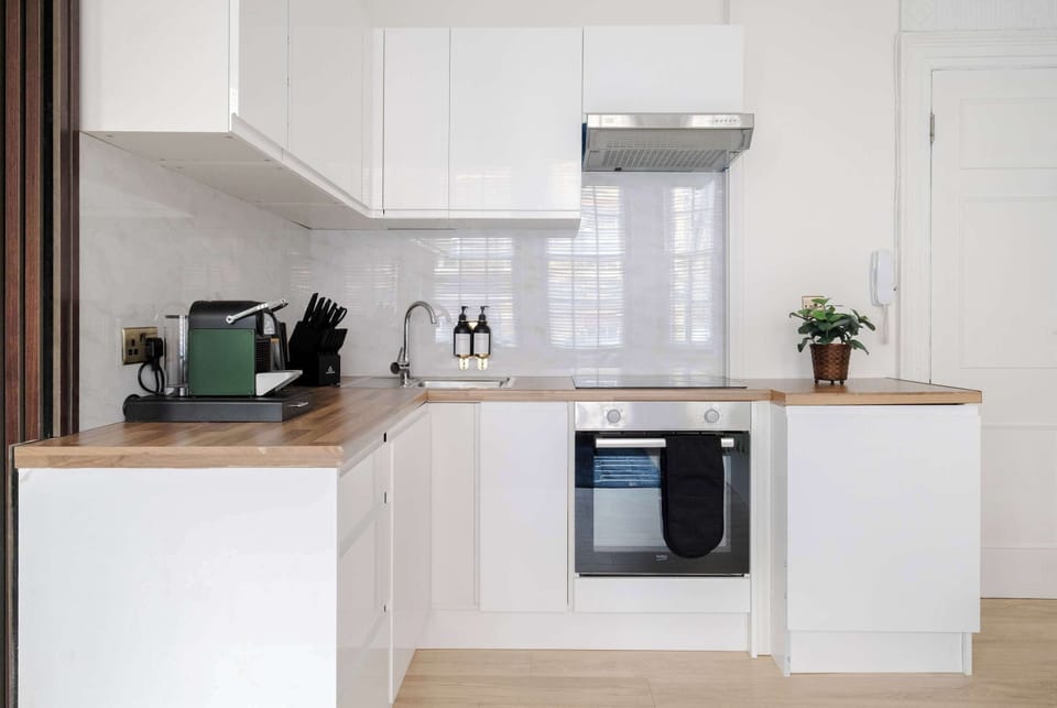 Full Kitchen | Make yourself at home in the fully equipped kitchen, ideal for any length of stay. With a washer, dryer and Nespresso machine, it offers all the essentials for a smooth and comfortable stay.