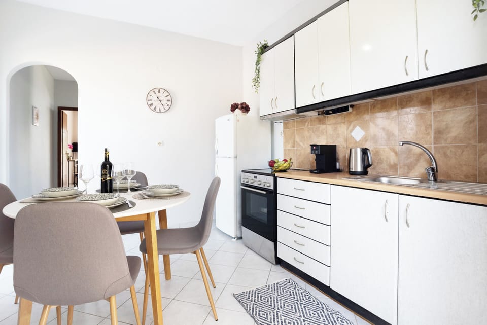 Apartment, 2 Bedrooms, Garden View | Private kitchen | Highchair, cookware/dishes/utensils