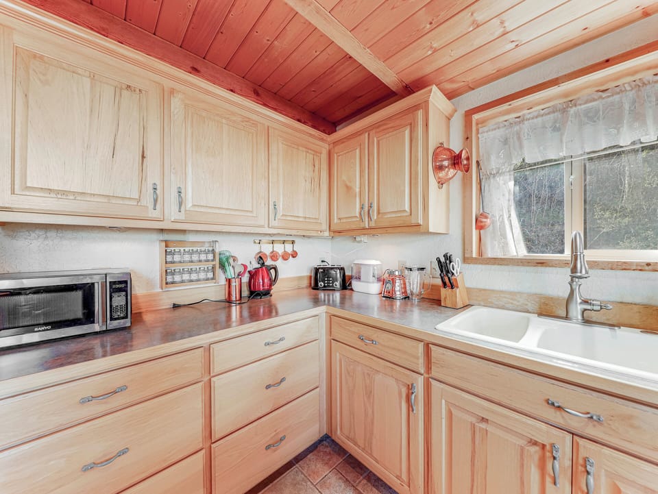 View of the spacious and fully stocked kitchen