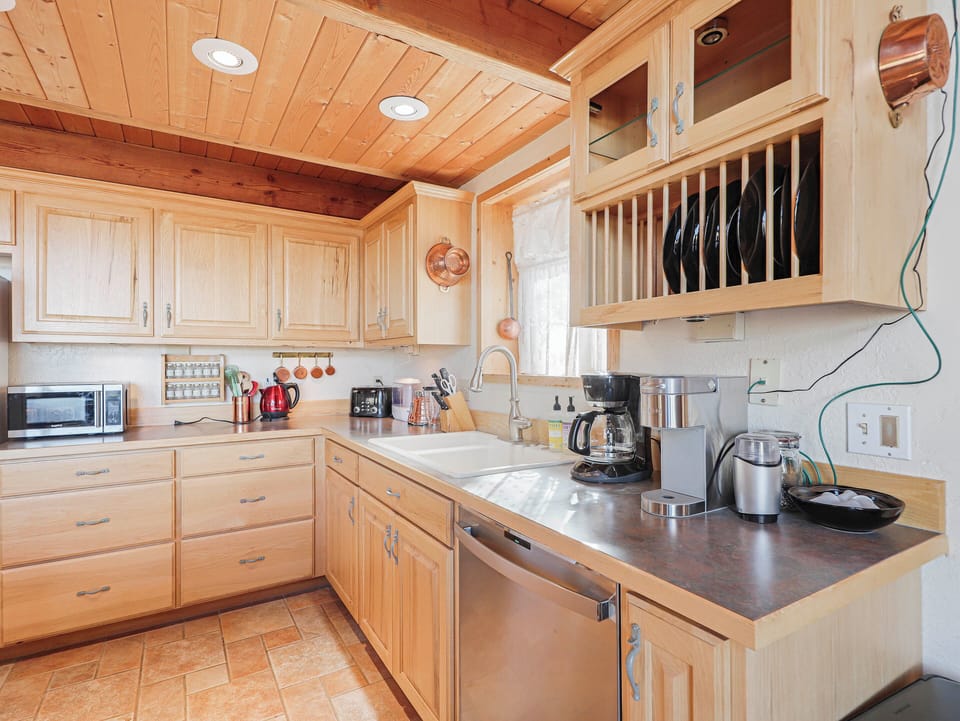 View of the spacious and fully stocked kitchen