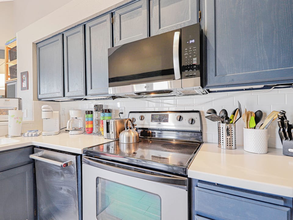 View of the fully loaded kitchen with updated appliances