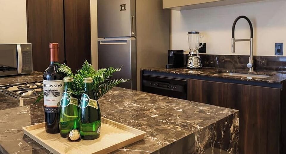 Modern kitchen w/ island, sink & sleek cabinetry for easy meal prep