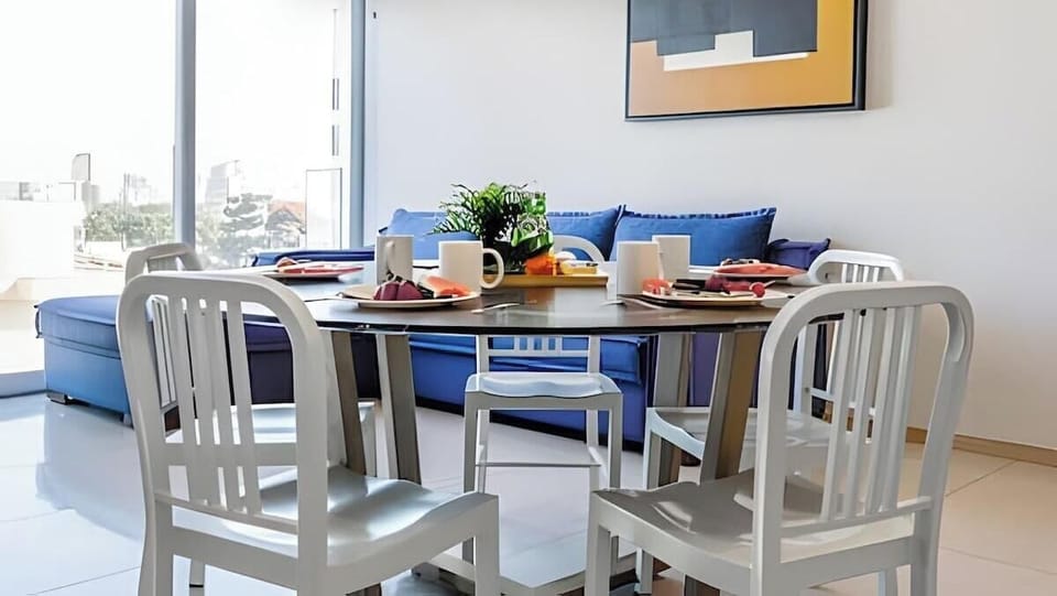 Sunlit dining nook w/ table set for a relaxed breakfast or dinner