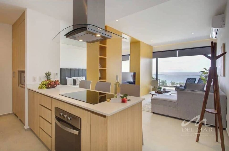 Bright kitchen w/ island seating, sleek counters & space to cook together