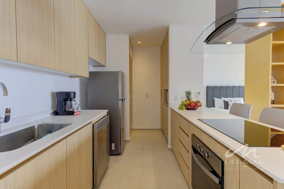 Sleek kitchen w/ modern cabinetry, stove & plenty of counter space for easy meals