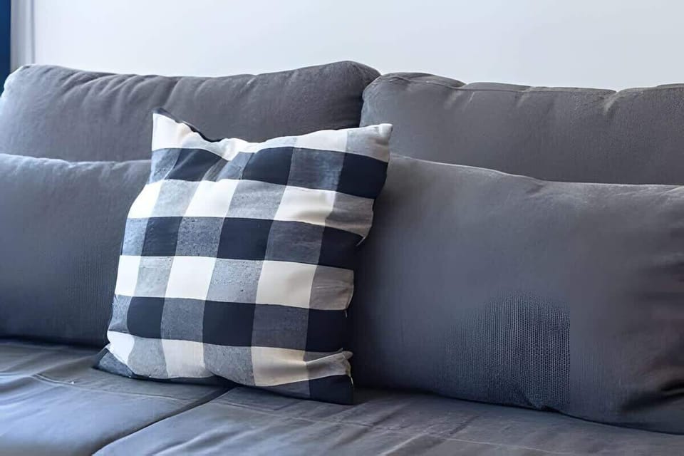 Plush sofa w/ cozy cushions, perfect for unwinding after a day out