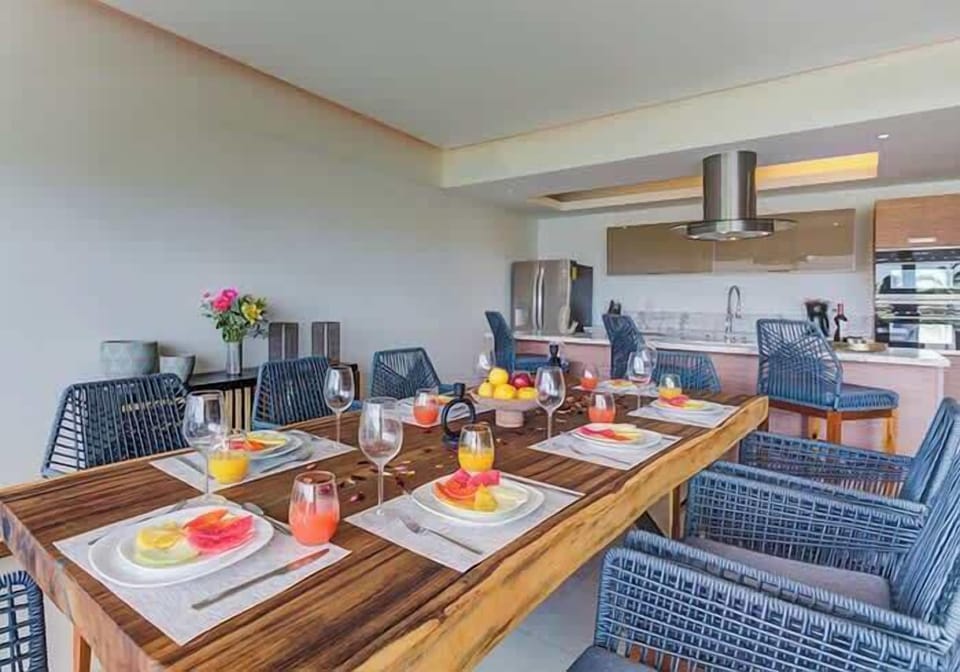 Large dining table set for a meal, creating a welcoming space for shared dinners
