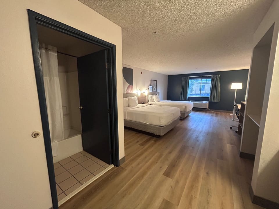 Standard Room, 2 Queen Beds, Non Smoking | Desk, laptop workspace, blackout drapes, iron/ironing board
