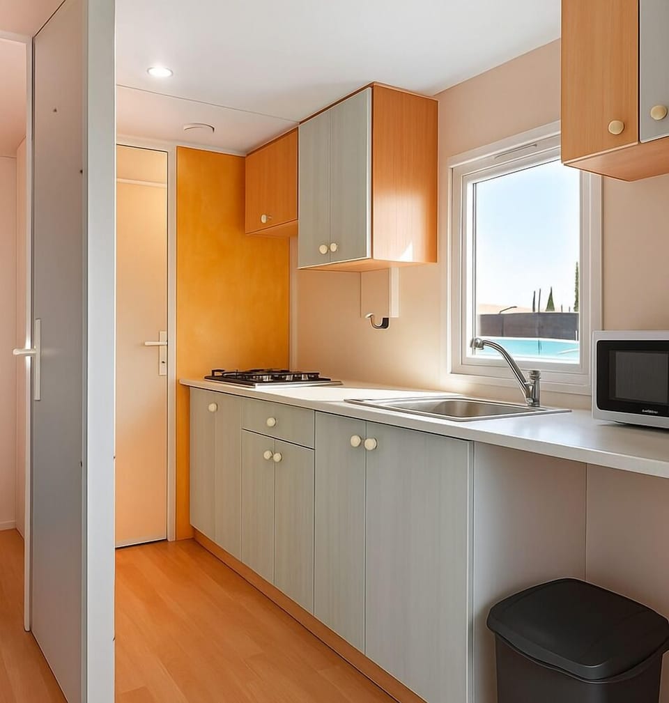 Full-size fridge, microwave, stovetop, cookware/dishes/utensils