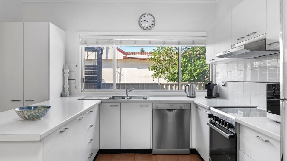 Whipping up breakfast is a breeze in this sleek, fully-equipped kitchen.