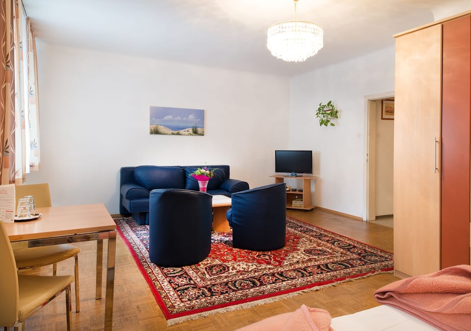 Studio, 2 Bedrooms | Living area | TV
