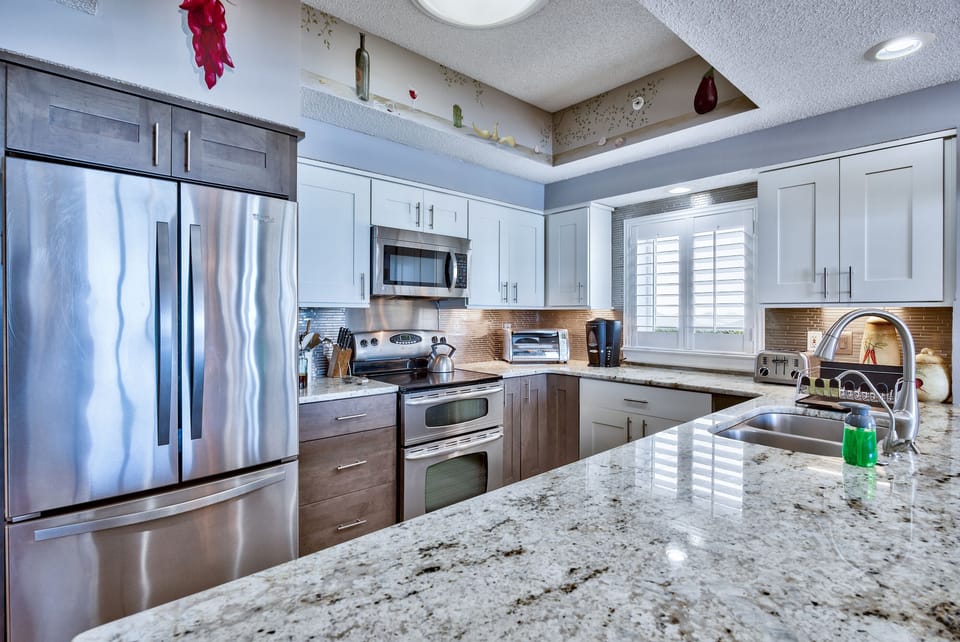Cook meals in your fully stocked and Remodeled kitchen with Gulf Views - Welcome to your home away from home!