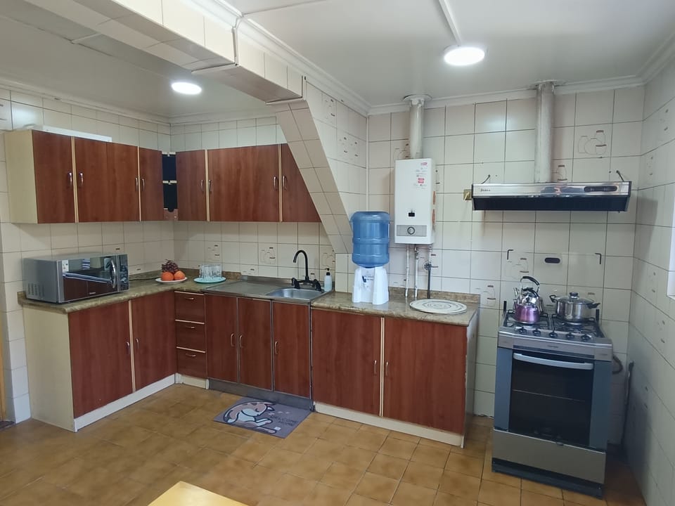 Family Triple Room, City View | Private kitchen | Shared fridge, microwave