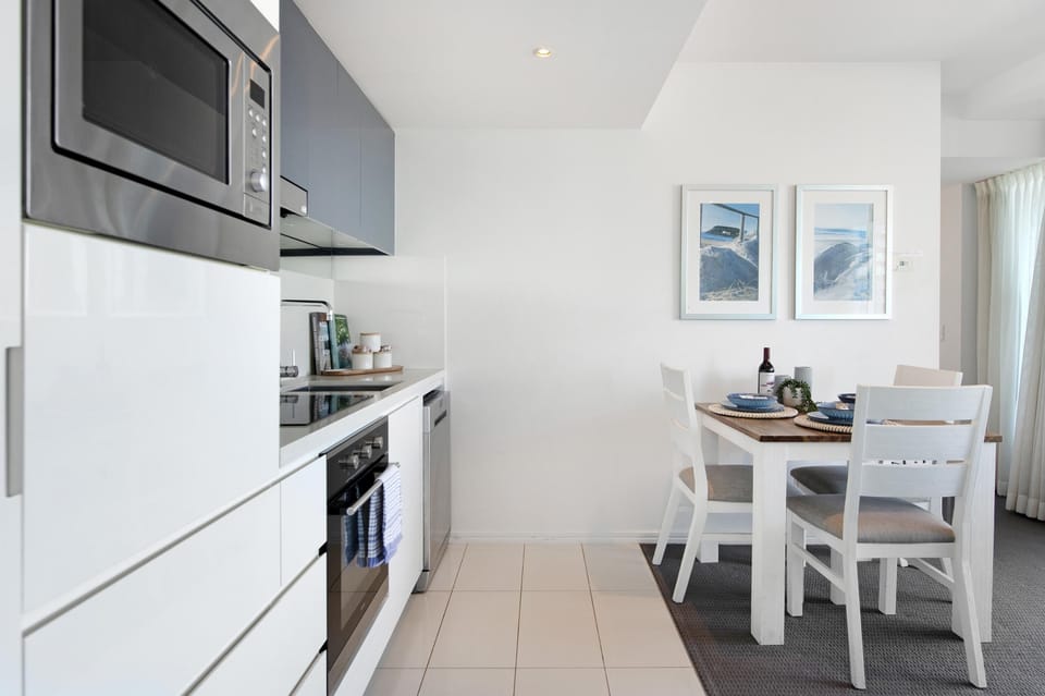 Fully equipped modern kitchen is right next to the dining area