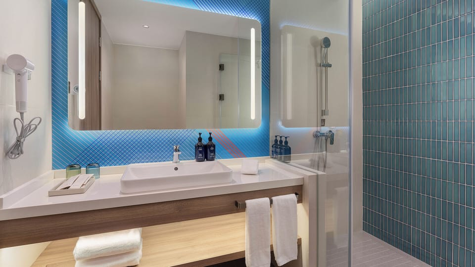 Suite, 1 Bedroom | Bathroom | Shower, hair dryer, slippers, towels