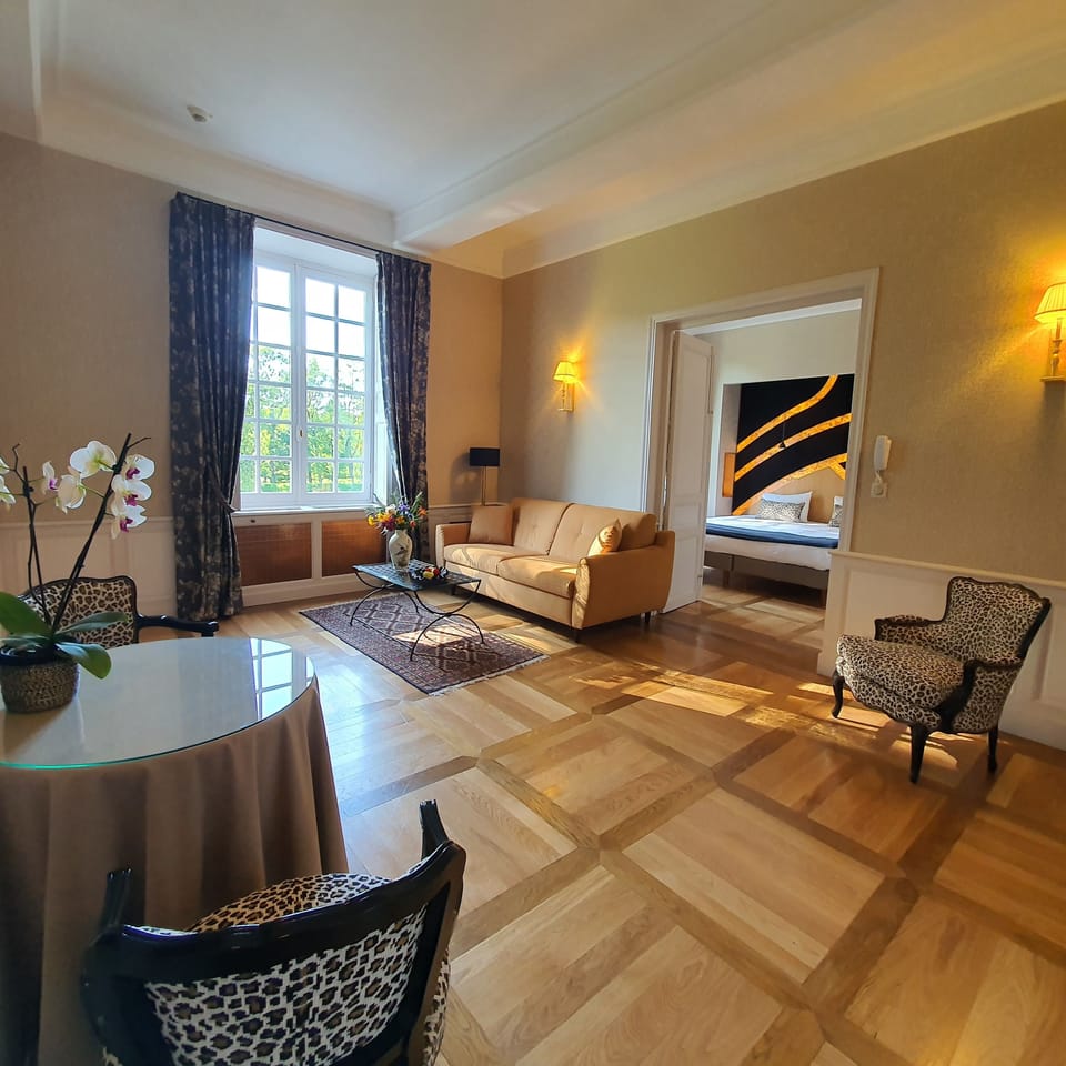 Deluxe Suite, 1 King Bed with Sofa bed, Garden Area | Pillowtop beds, minibar, in-room safe, blackout drapes