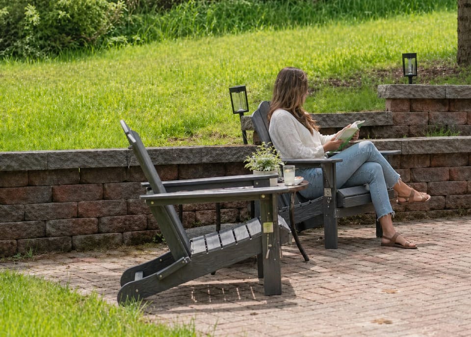 Relaxing Adirondack chairs overlooking the backyard fire pit
