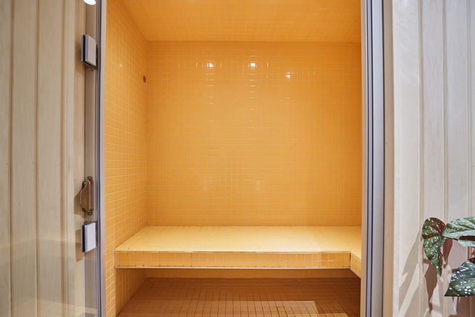 Modern hammam offering a calming steam experience in a serene, private setting.