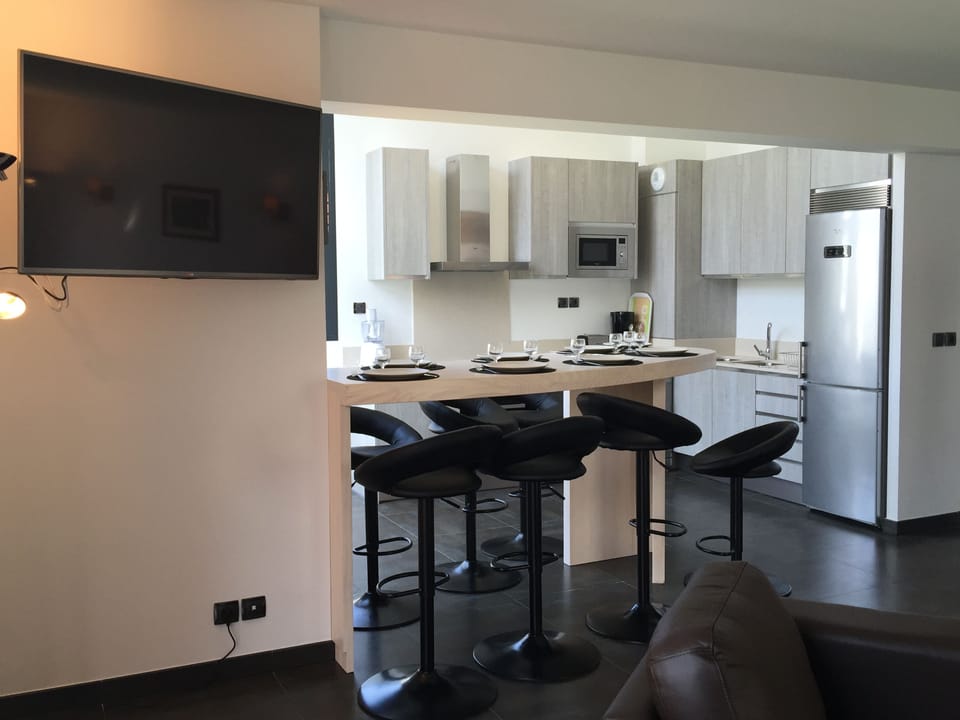 Stylish kitchen and dining area equipped with everything you need for home-cooked meals.