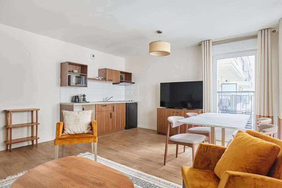 Stylish dining area adjacent to the kitchen and lounge, blending convenience with charm.