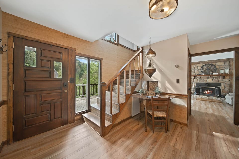 Foyer, Lots of Windows, and Steps to the Upper Level Bedroom