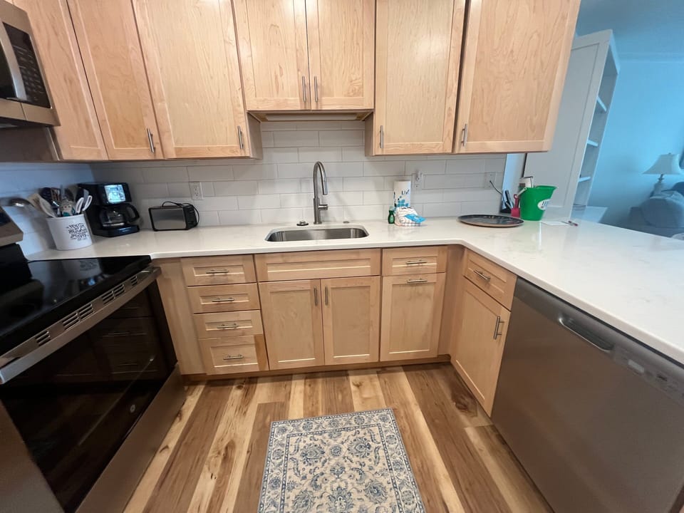 Stainless steel appliances, ample cabinet storage, and generous counter space make meal prep simple and efficient.
