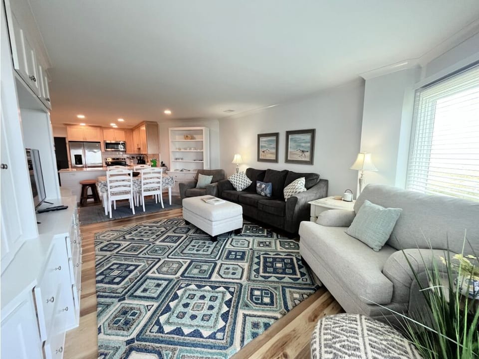 Natural light fills the room, highlighting the tile floors and creating an airy, welcoming feel.